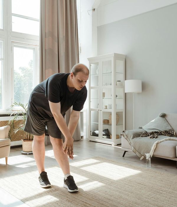 Person doing morning mobility exercises in a bright room